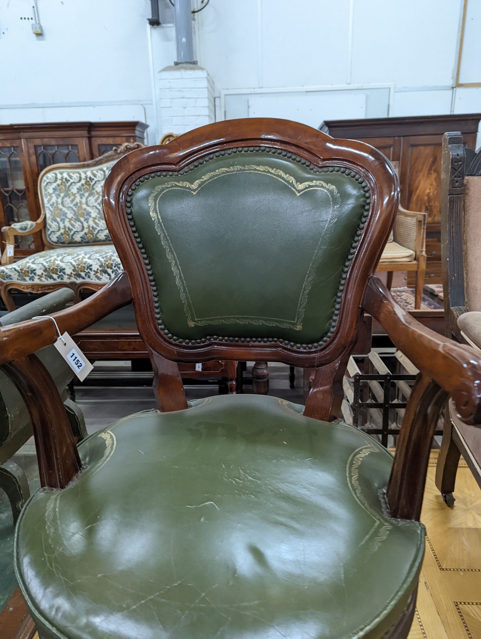 A Victorian style mahogany and green leather swivel desk chair, width 60cm, depth 50cm, height 96cm